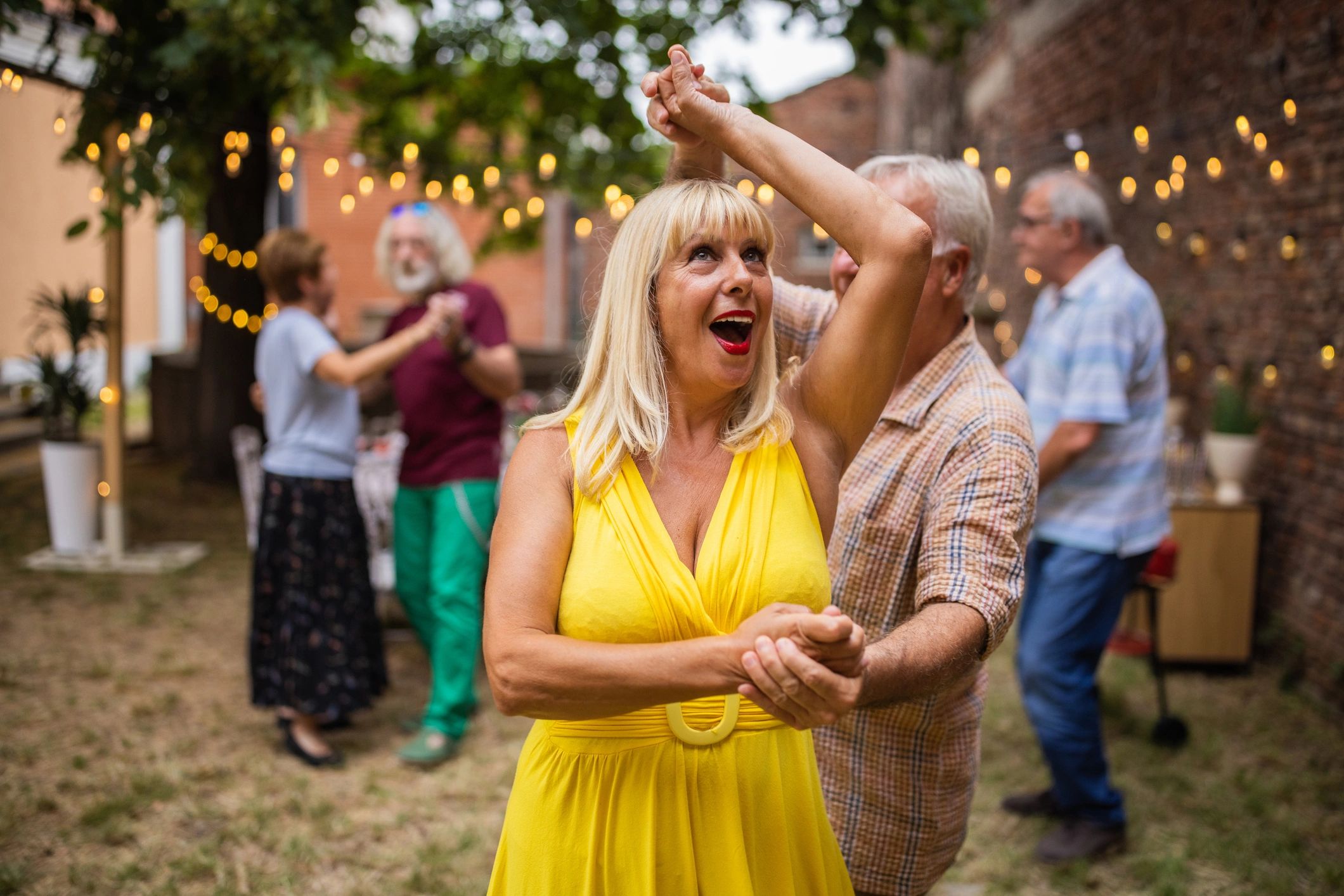 Couple dancing at an outdoor party
