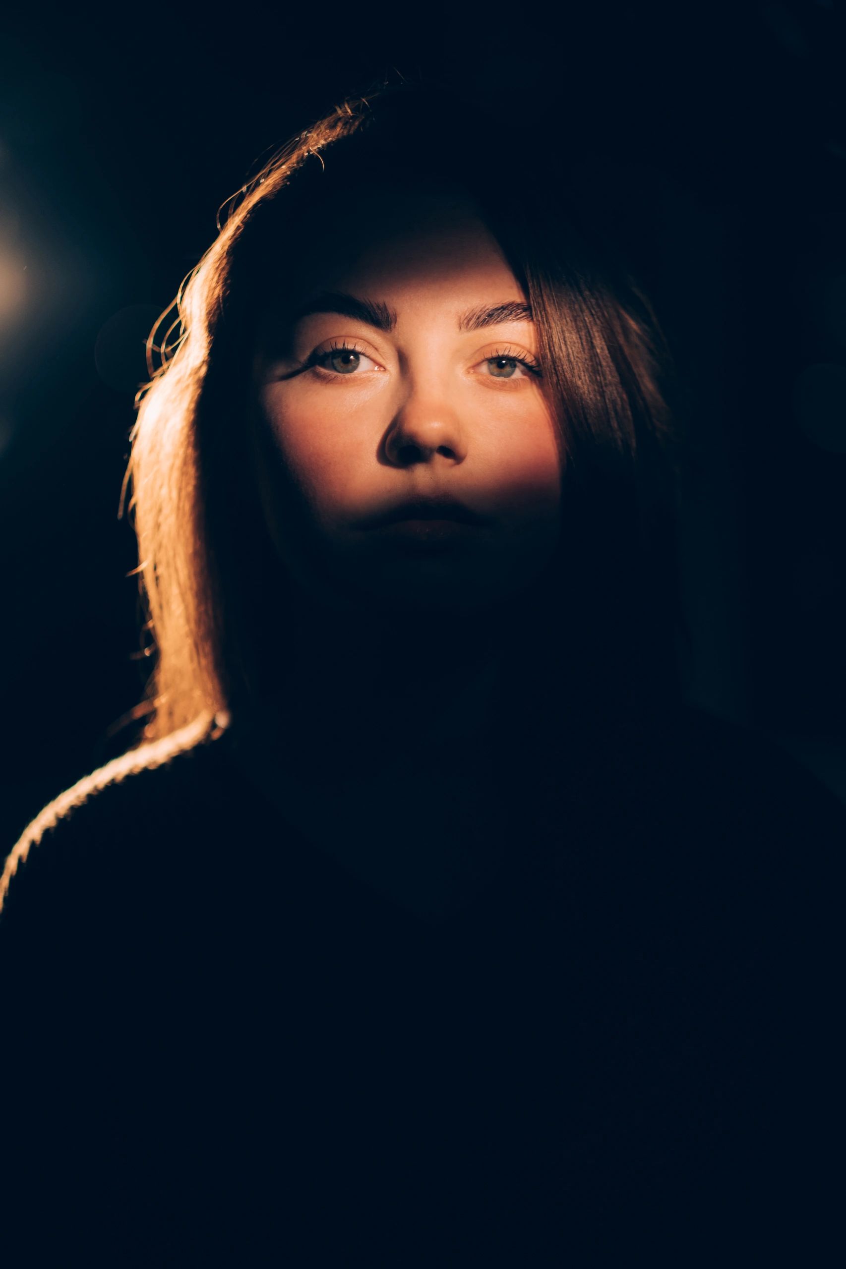 Low-light portrait with warm shadows