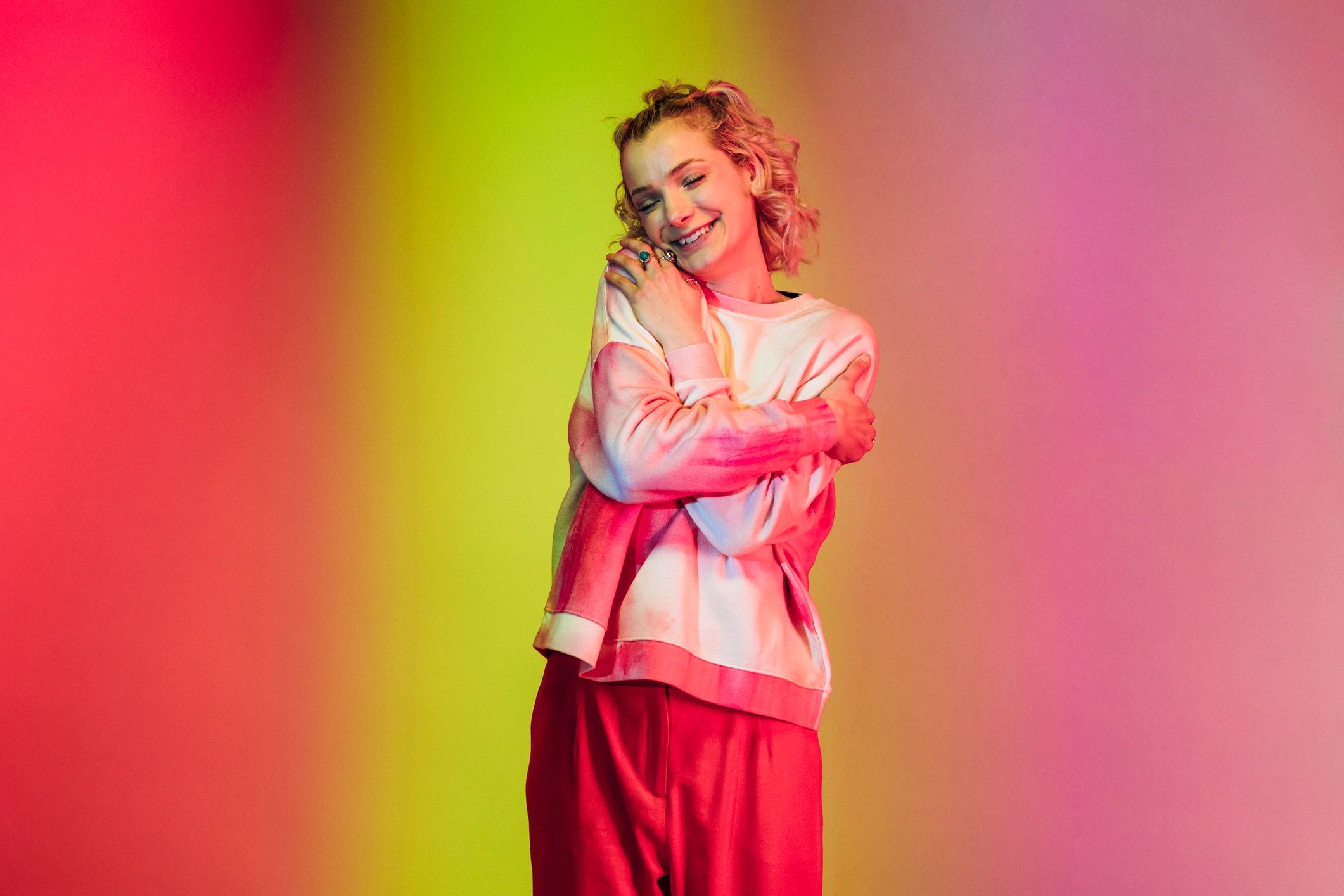 Studio portrait with colorful background lighting for brand imagery