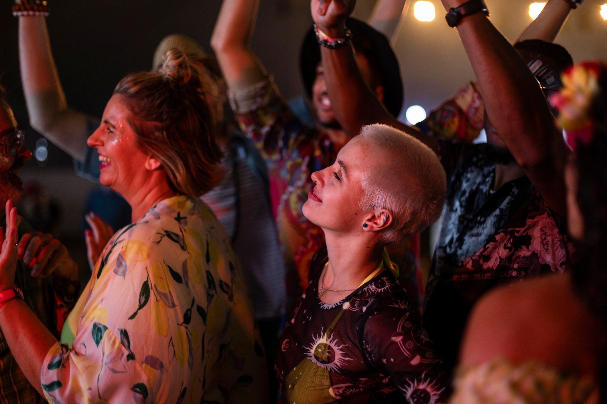 Friends enjoying a live show at a festival