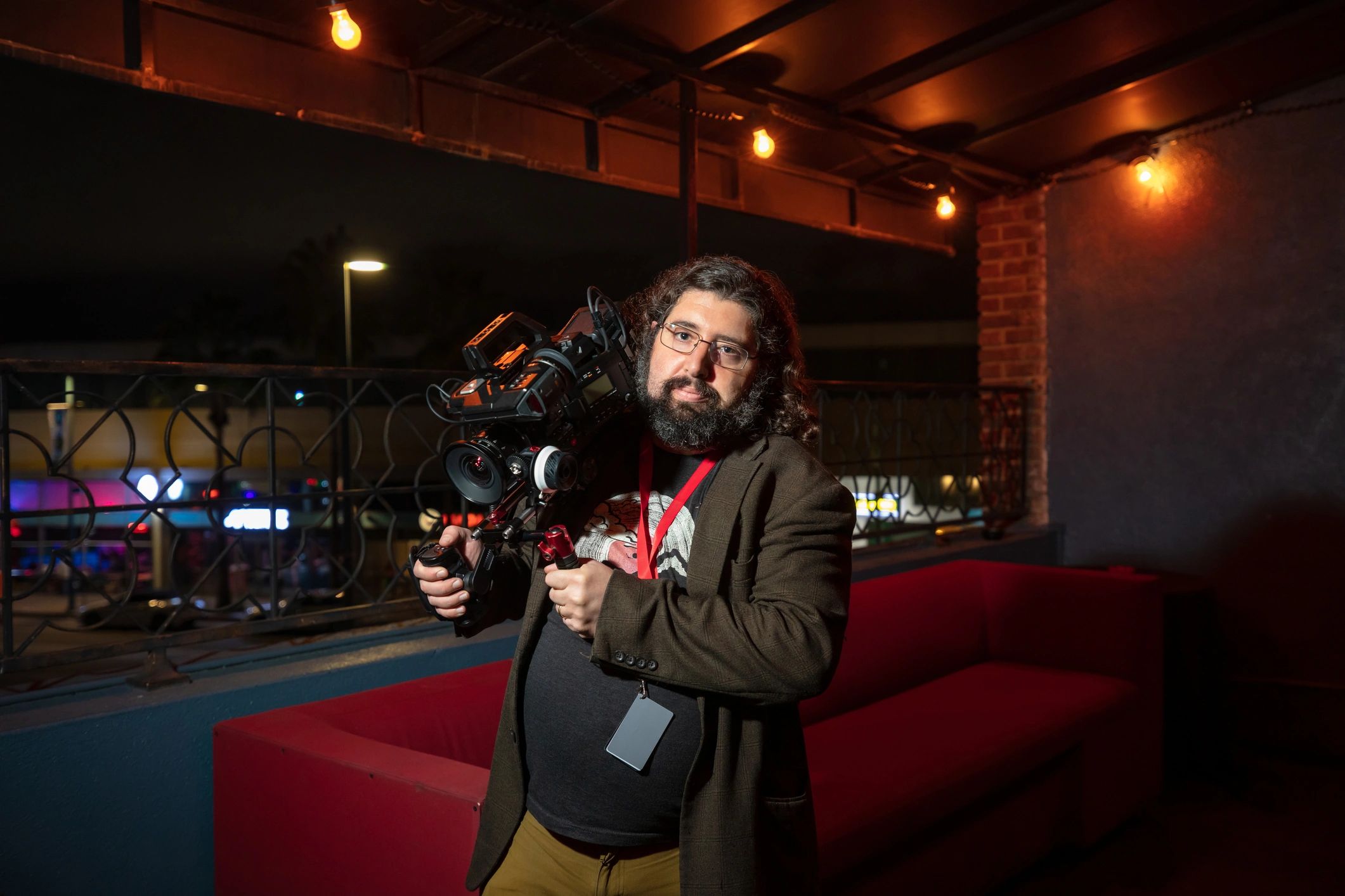 Portrait of a videographer holding a camera