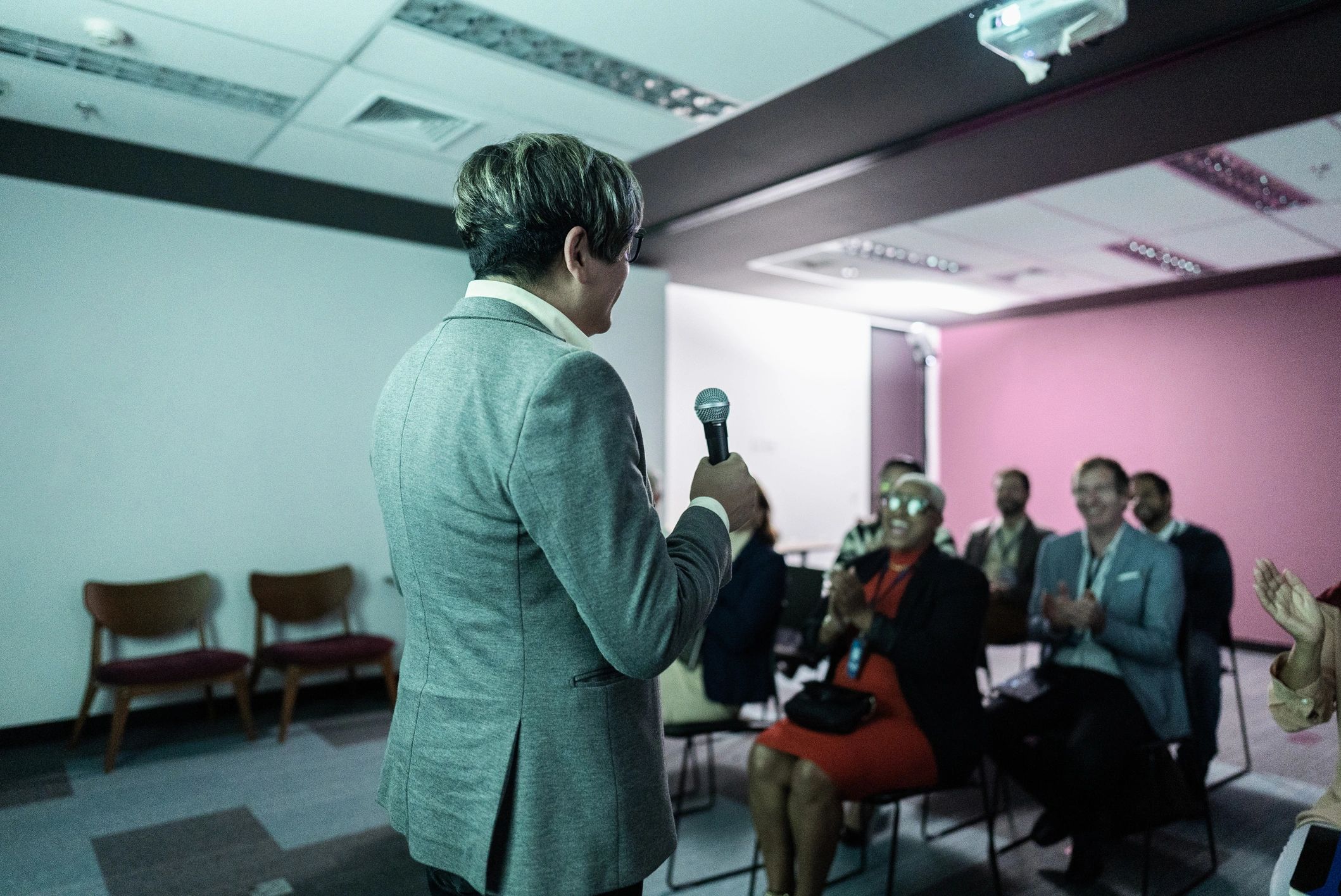 Speaker presenting at a business conference